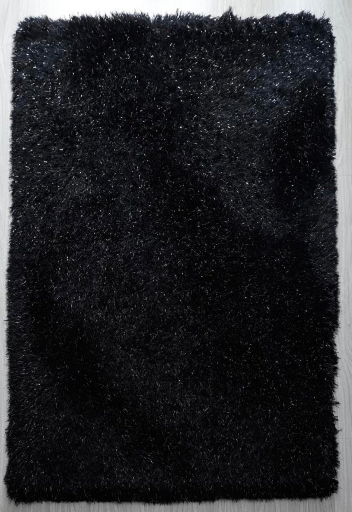 Alfombra de pelo largo negra y plateada