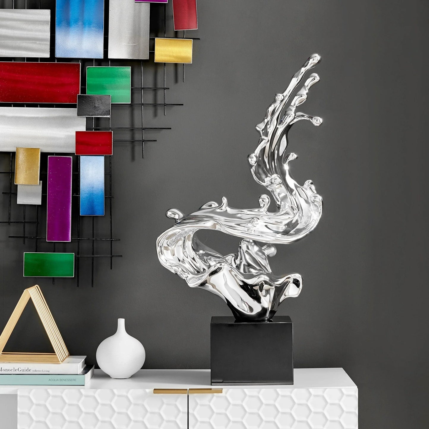 ESCULTURA ROMPEOLAS // CROMADA, 61 CM DE ALTO